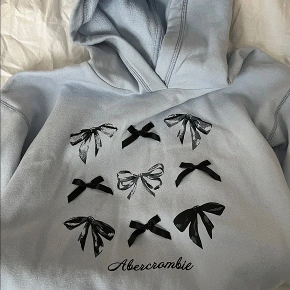 Abercrombie Kids Light Blue Hoodie with Black Bow Design 13/14 - Picture 1 of 5